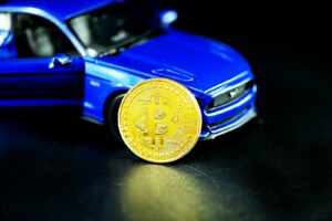 blue car with gold round coin