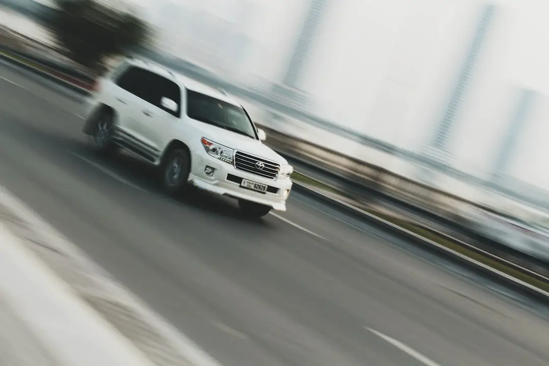 time lapse photography of white sport utility vehicle