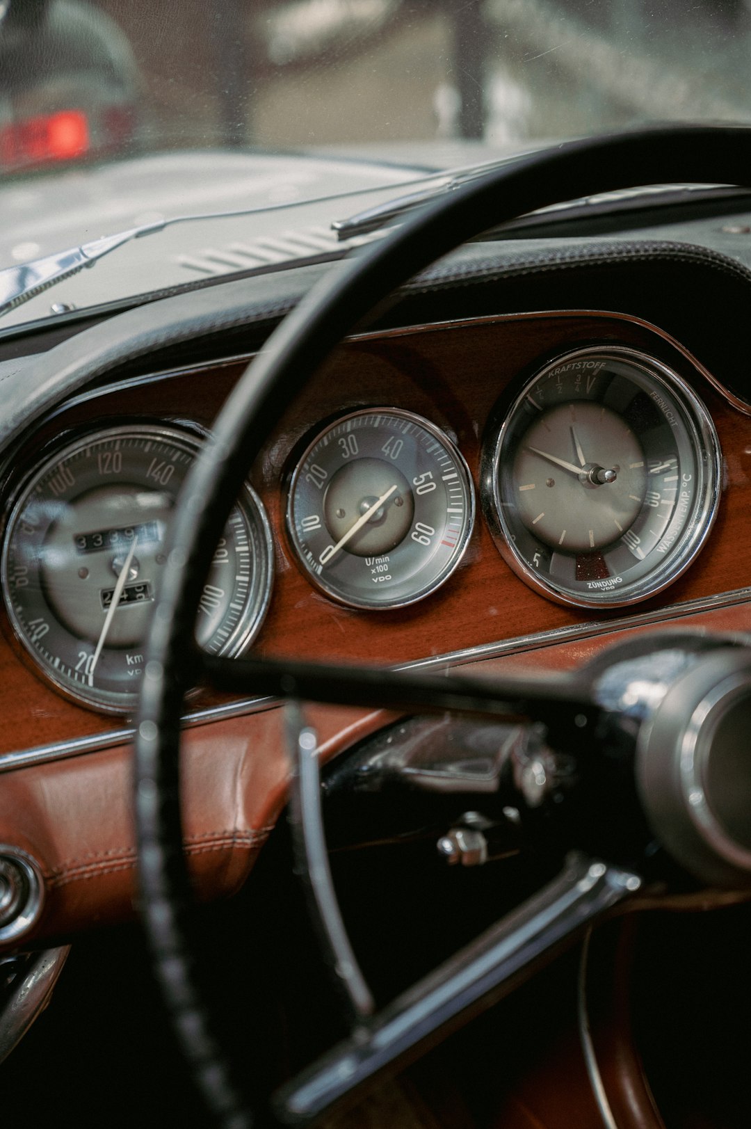 a dashboard of a car with gauges and a steering wheel