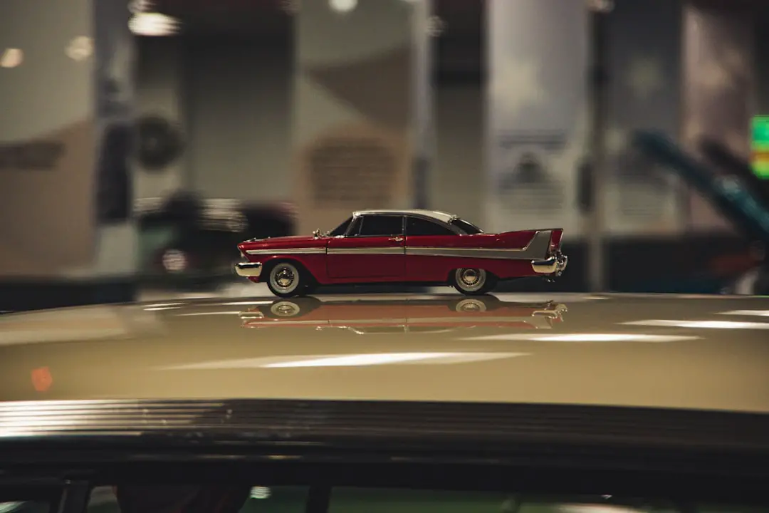 a toy car is sitting on top of a car