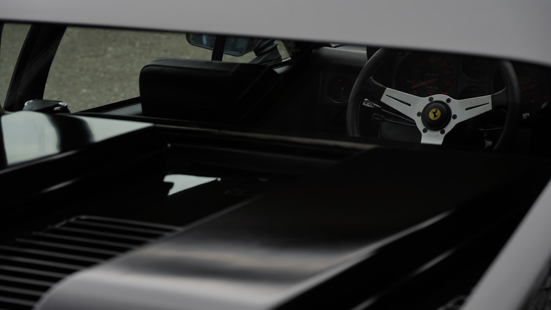 the interior of a car with a steering wheel and dashboard